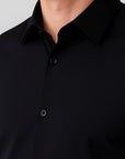 Close-up of a black button-up shirt on a gray background
