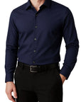 Navy blue dress shirt worn by a person on a white background