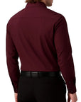 Maroon dress shirt worn by a person on a white background