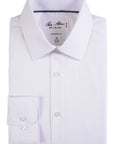 Folded white dress shirt with 'Bill Blass' label on a white background