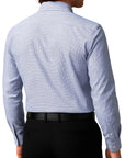 Person wearing a blue checkered dress shirt and black pants on a white background