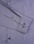 Close-up of a purple checkered shirt with cuff details