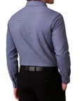 Blue checkered shirt worn by a person on a white background