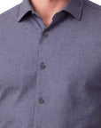 Blue checkered shirt worn by a person on a white background