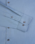 Close-up of a blue checkered shirt with cuff details