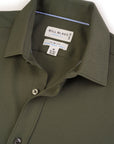 Green shirt with Bill Blass label on a white background