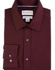 Folded maroon shirt with 'Bill Blass' label on a white background