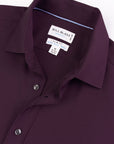 Close-up of a Bill Blass shirt with collar and label on a white background