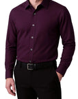 Purple dress shirt worn by a person on a white background