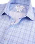 Close-up of a blue checkered shirt with a Bill Blass label.