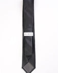 Black patterned tie with 'Bill Blass' label on a white background