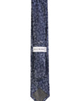 Navy floral patterned tie with 'Bill Blass' label on a white background