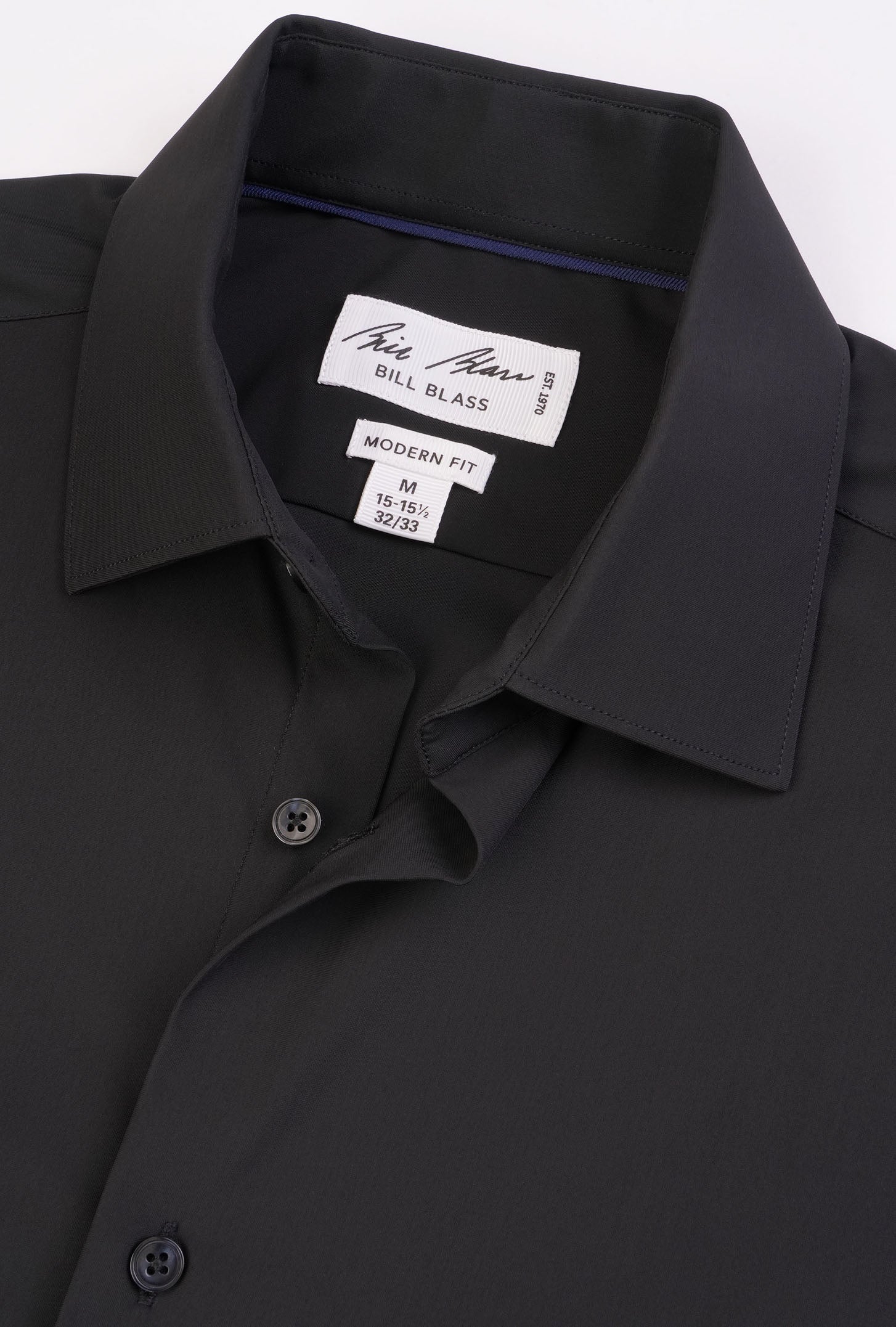 Black dress shirt with Bill Blass label on a white background
