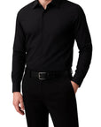 Black dress shirt and pants on a white background