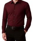 Maroon dress shirt worn by a person on a white background