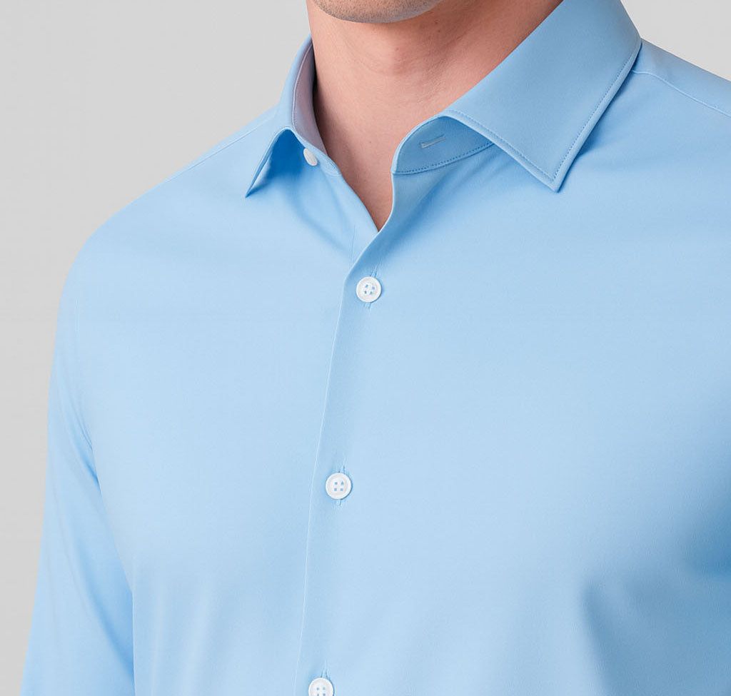 Light blue shirt with collar and buttons on a neutral background