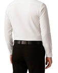 White dress shirt and black pants on a white background