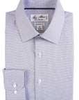 Folded dress shirt with a checkered pattern on a white background