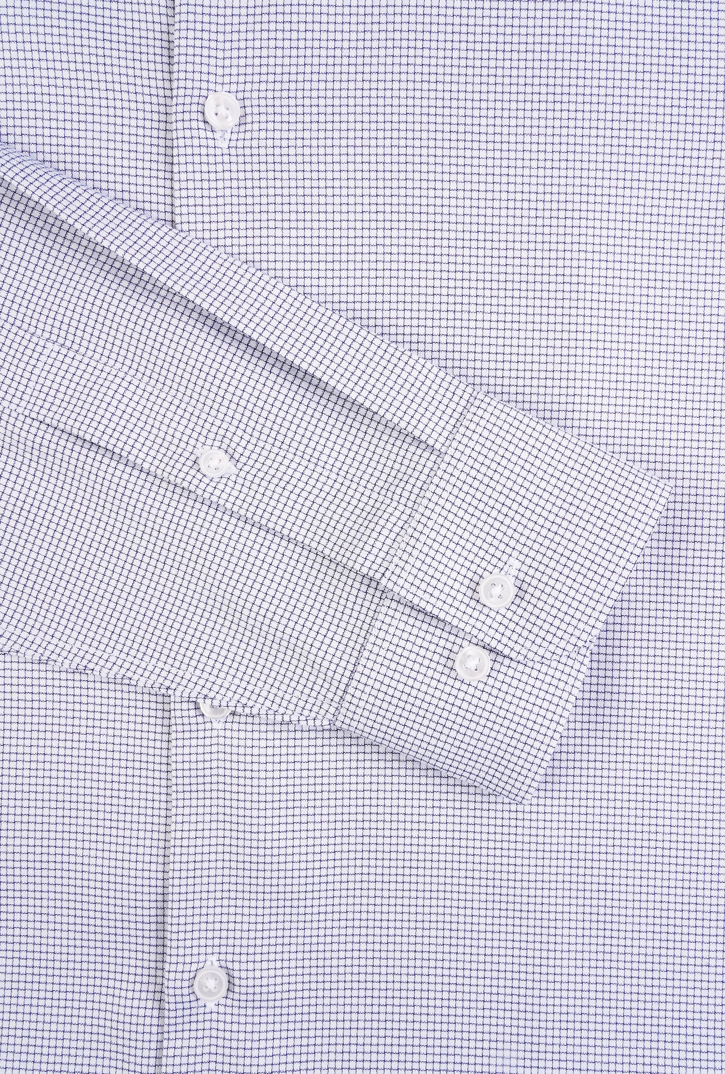 Close-up of a blue checkered dress shirt with rolled-up sleeves.