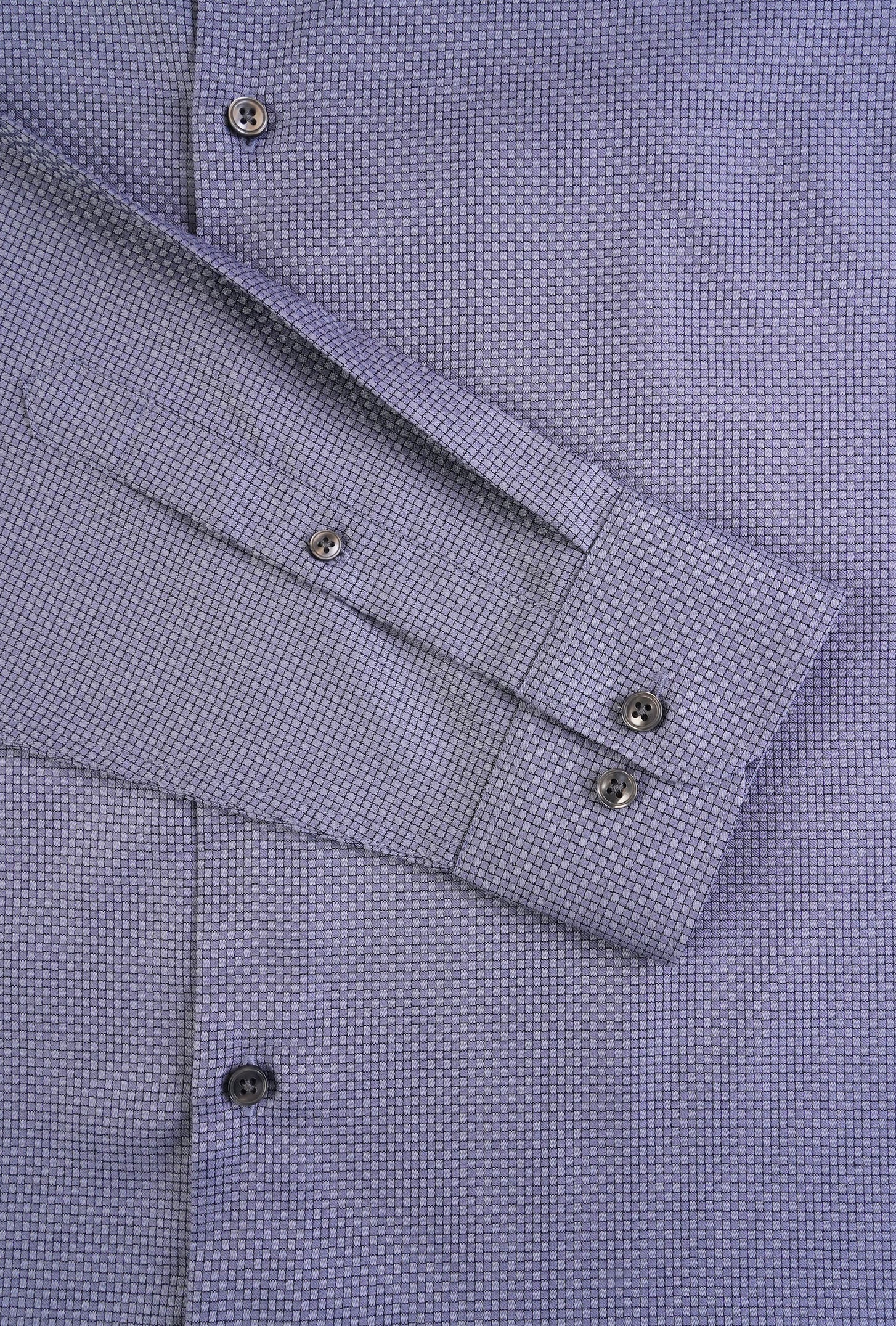 Close-up of a purple checkered shirt with cuff details