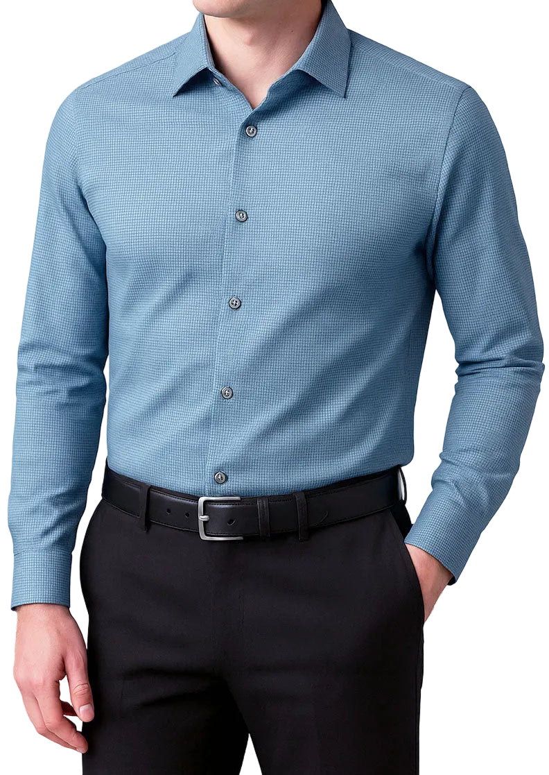 Man wearing a blue checkered shirt and black pants on a white background