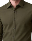 Green button-up shirt on a white background