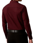 Maroon shirt worn by a person on a white background