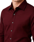 Maroon button-up shirt worn by a person on a white background
