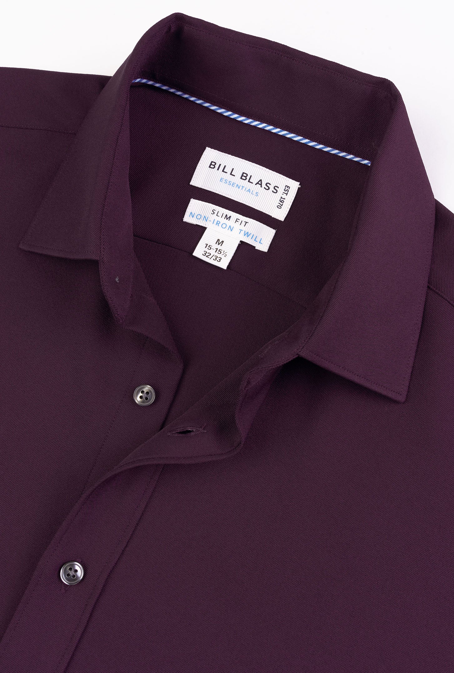 Close-up of a Bill Blass shirt with collar and label on a white background