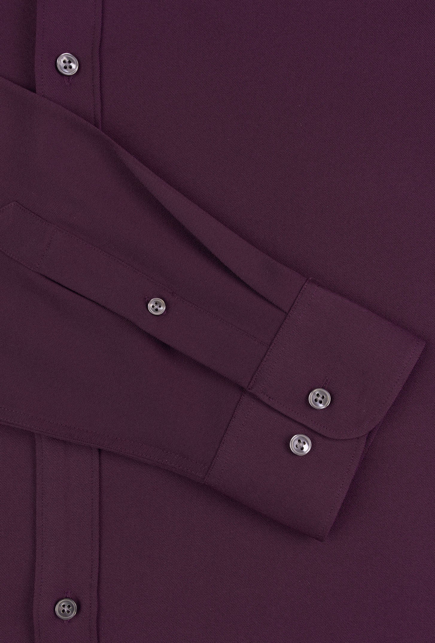 Close-up of a purple shirt with button details