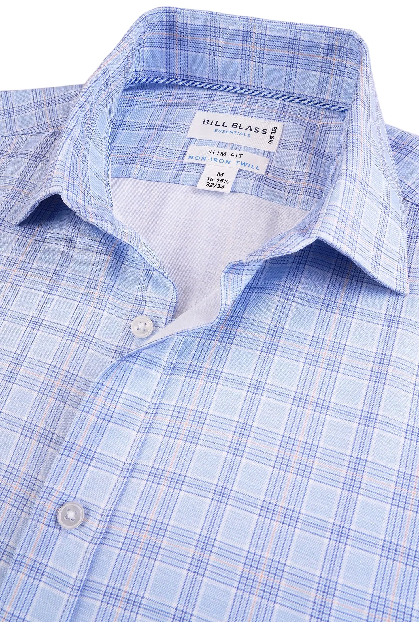 Close-up of a blue checkered shirt with a Bill Blass label.