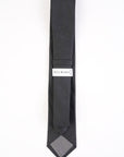 Black tie with a patterned end and 'Bill Blass' label on a white background