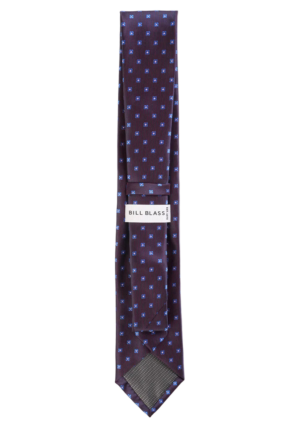 Patterned tie with 'Bill Blass' label on a white background