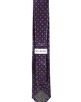 Patterned tie with 'Bill Blass' label on a white background